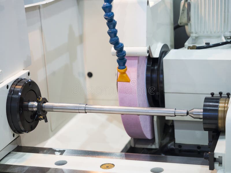 Operator grinding mold and die part stock image