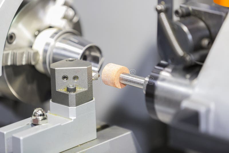 Operator grinding mold and die part stock photos