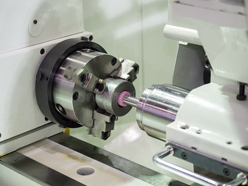 Operator grinding mold and die part by universal grining machine royalty free stock image
