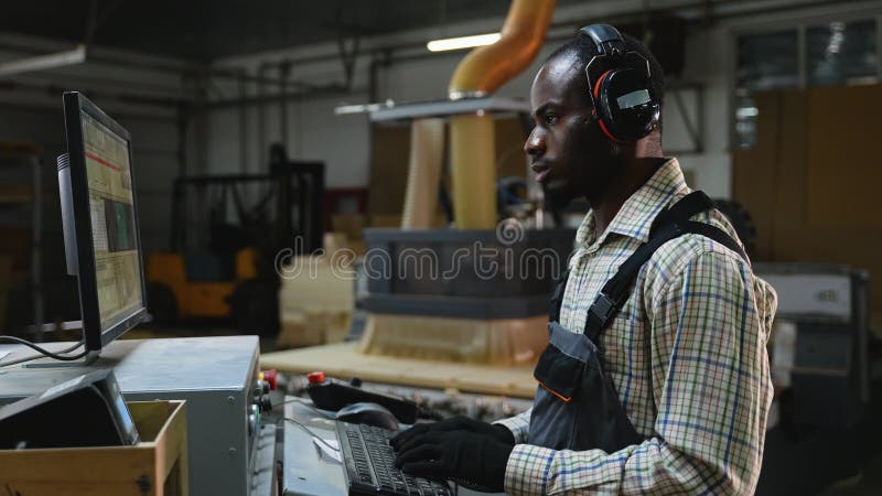 Operator Programmes CNC Machine for Wood Cut stock footage