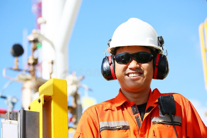 Operator recording operation of oil and gas process at oil and rig plant, offshore oil and gas industry, offshore oil and rig stock photos Operator recording operation of oil and gas process at oil and rig plant, offshore oil and gas industry, offshore oil and rig stock photos