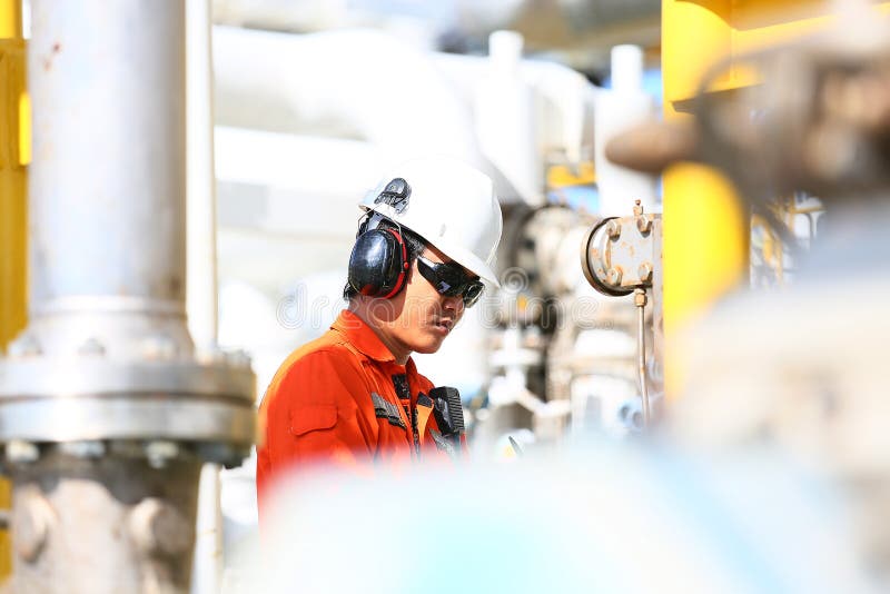 Operator recording operation of oil and gas process at oil and rig plant, offshore oil and gas industry, offshore oil and rig royalty free stock image Operator recording operation of oil and gas process at oil and rig plant, offshore oil and gas industry, offshore oil and rig royalty free stock image