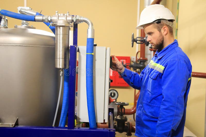 Maintenance Engineer Controls a Work Technological Process and Tests a Work Gauge Pressure Stock