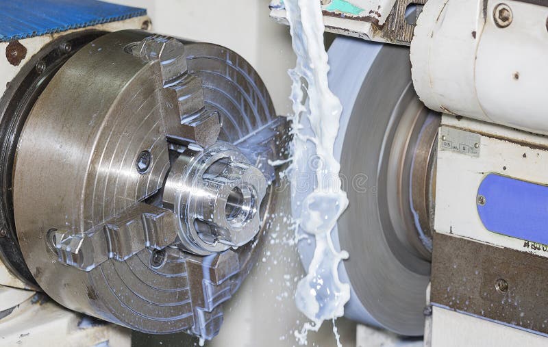 Operators grinding mold and die part by universal grining machine royalty free stock photography