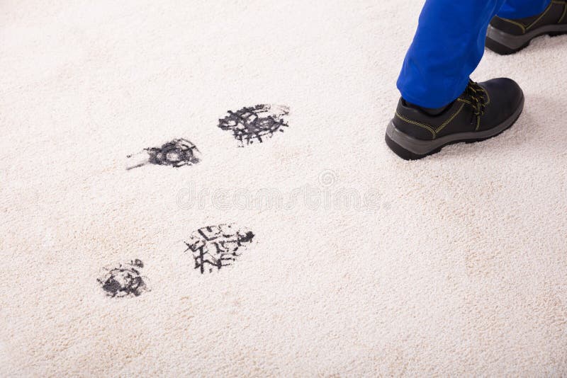 Opgeheven Mening van Muddy Footprint On Carpet royalty-vrije stock fotografie Opgeheven Mening van Muddy Footprint On Carpet royalty-vrije stock fotografie