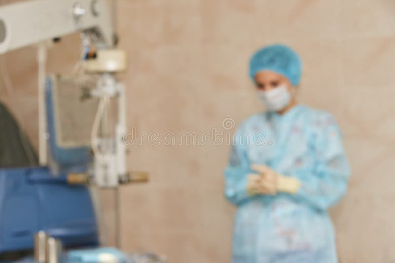 Ophthalmology laser microscope operation. Clinic room with doctor and parient. Blur background. Unfocus, selective focus.