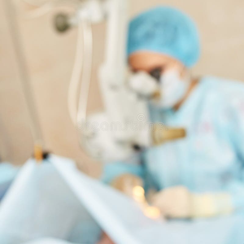 Ophthalmology laser microscope operation. Clinic room with doctor and parient. Blur background. Unfocus, selective focus.