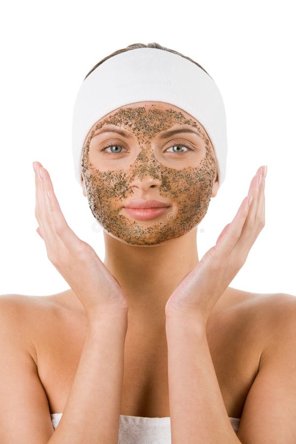 Beautiful woman with purifying facial mask keeping her palms by her face. Beautiful woman with purifying facial mask keeping her palms by her face