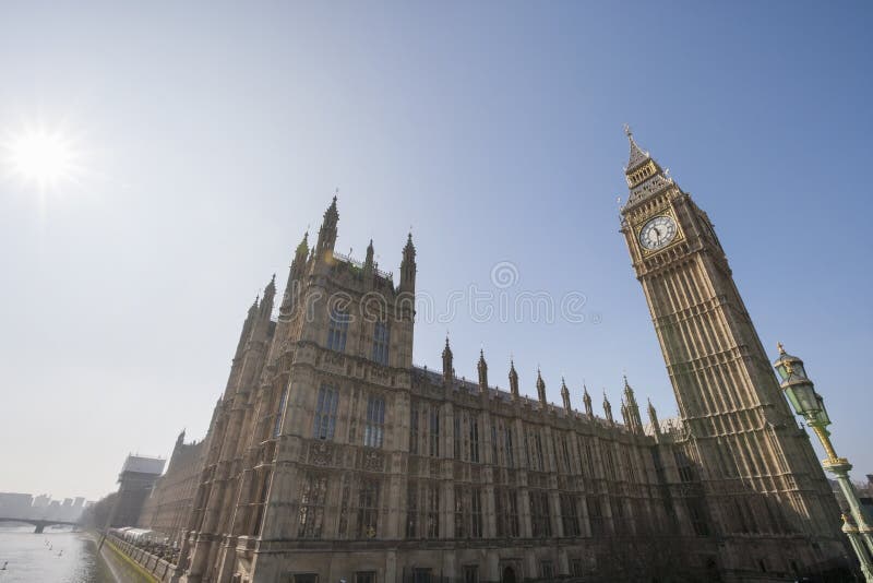Low angle view of Big Ben and parliament building against clear sky at London, England, UK. Low angle view of Big Ben and parliament building against clear sky at London, England, UK