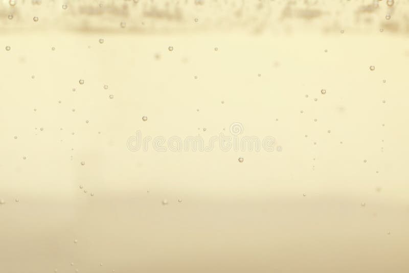 Closeup view of champagne with bubbles as background. Closeup view of champagne with bubbles as background