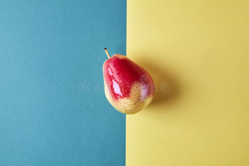 Whole fresh pear fruit view from above on green yellow background, modern style food picture, pattern design. Whole fresh pear fruit view from above on green yellow background, modern style food picture, pattern design