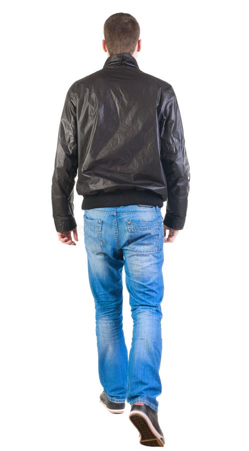 Opinião traseira o homem considerável de passeio no revestimento. fotografia de stock Opinião traseira o homem considerável de passeio no revestimento. fotografia de stock