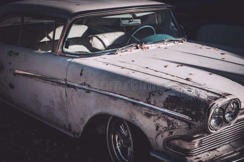 Partial close up of an old untouched and not restored classic car from 1958. Partial close up of an old untouched and not restored classic car from 1958