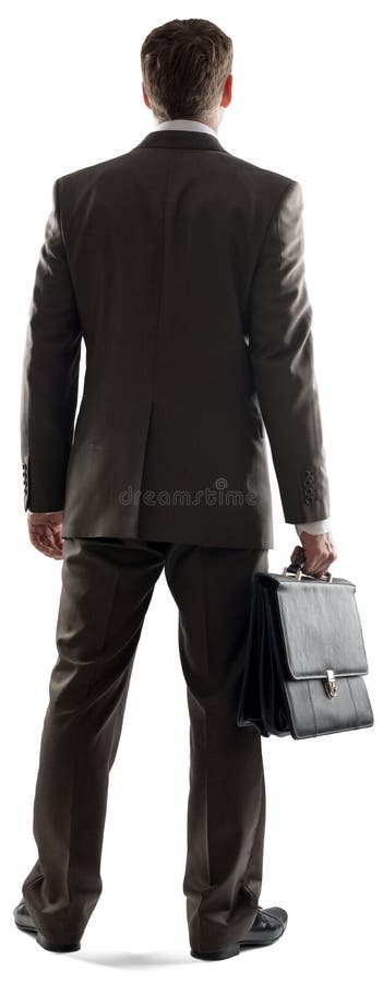 Opinión trasera el hombre de negocios que se coloca con la cartera foto de archivo Opinión trasera el hombre de negocios que se coloca con la cartera foto de archivo