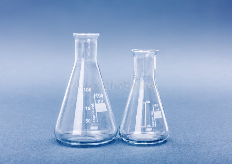 Empty 50 and 100 milliliter Erlenmeyer chemistry flasks on blue background. Empty 50 and 100 milliliter Erlenmeyer chemistry flasks on blue background