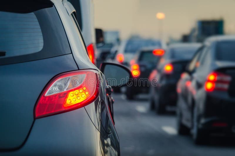 Traffic jam with row of cars on expressway during rush hour. Traffic jam with row of cars on expressway during rush hour