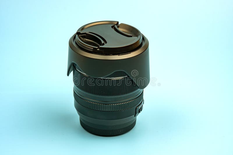 Optical digital camera lens isolated on blue background