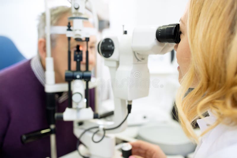 Optical Review of Patient Eyes with Apparatus Stock Photo Image of