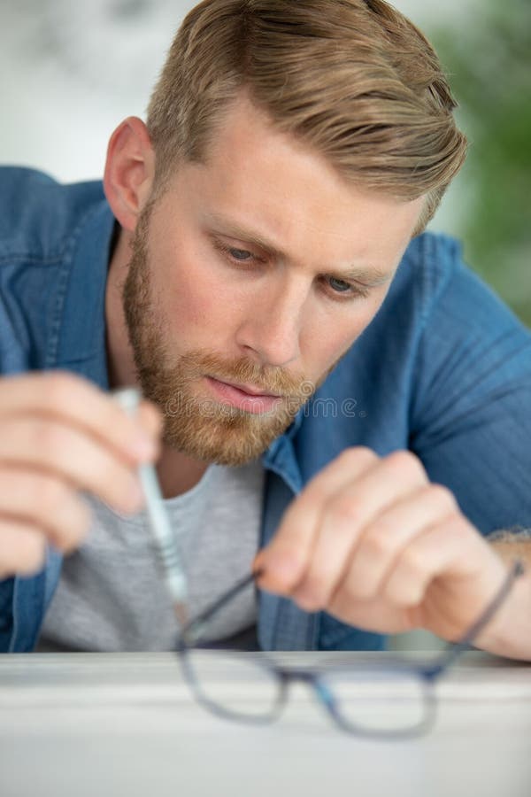 Optician Repairing and Fixing Eye Glasses Stock Image Image of