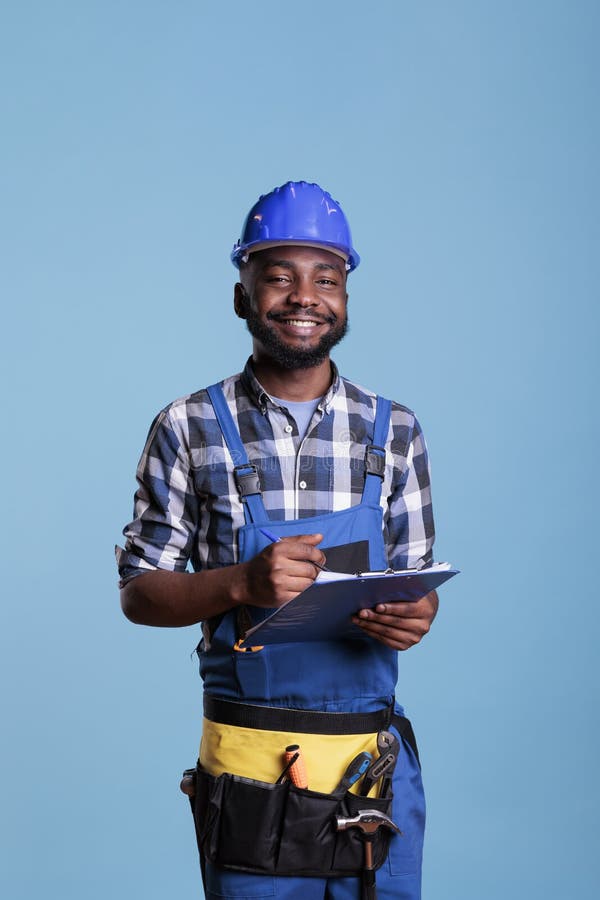 Optimistic Builder Reviewing Construction Paperwork Stock Photo Image of hand, copy 261466436