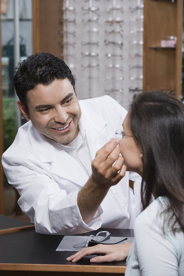 Optometrist Assisting Female Patient In Choosing Glasses Stock Image Image Of Occupation