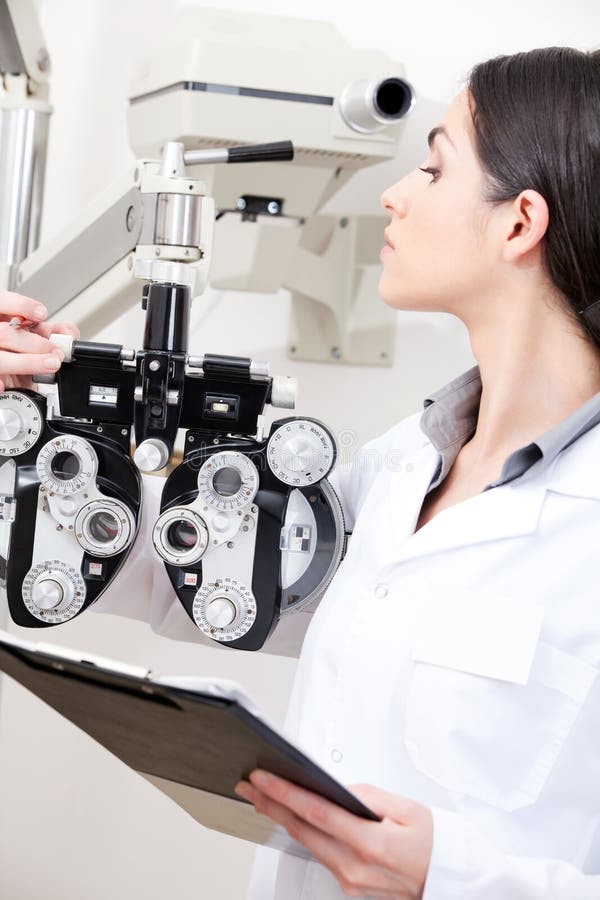 Optometrist Looking at Woman Holding Contact Lens Stock Photo Image