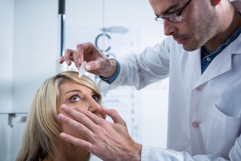 Optometrist Putting Drops into Patients Eyes Stock Photo Image of
