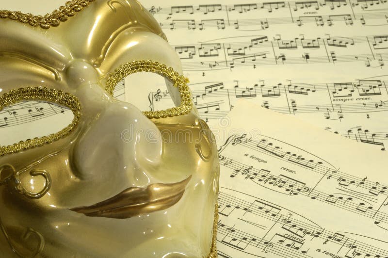 Photo of a Mask on Sheetmusic - Opera / Theater Concept. Photo of a Mask on Sheetmusic - Opera / Theater Concept