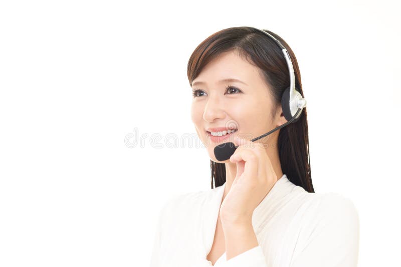 Opérateur de sourire de centre d'attention téléphonique photographie stock libre de droits Opérateur de sourire de centre d'attention téléphonique photographie stock libre de droits