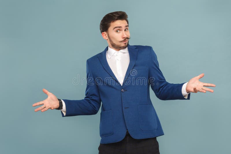 I don`t now. Portrait of confused man. Business people concept, richly and success. Indoor, studio shot on light blue background. I don`t now. Portrait of confused man. Business people concept, richly and success. Indoor, studio shot on light blue background