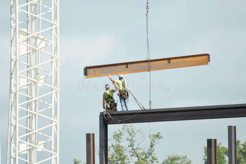 Two construction workers, at the SoNo Collection mall in South Norwalk, Connecticut, working at death defying heights. Great Balance!. Two construction workers, at the SoNo Collection mall in South Norwalk, Connecticut, working at death defying heights. Great Balance!