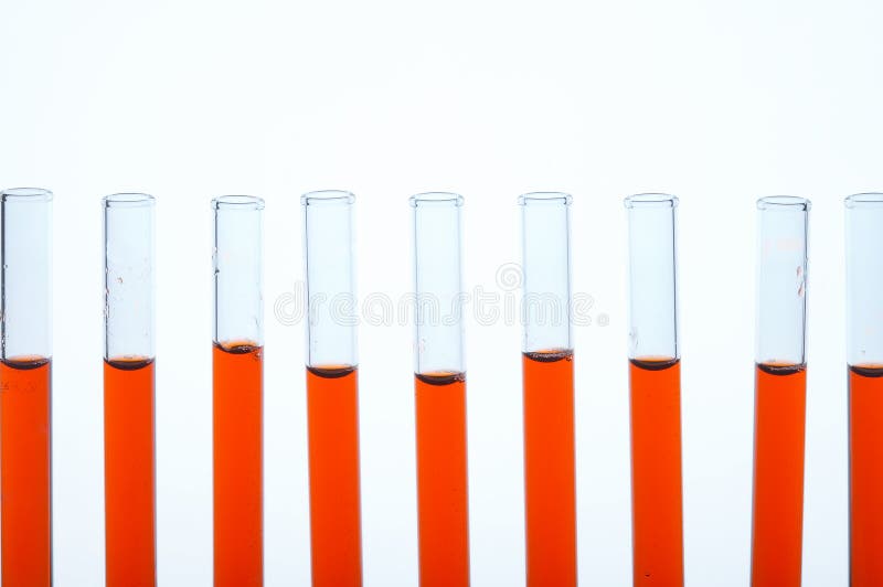 Laboratory Glass Test Tubes Filled With Orange Liquid For An Experiment