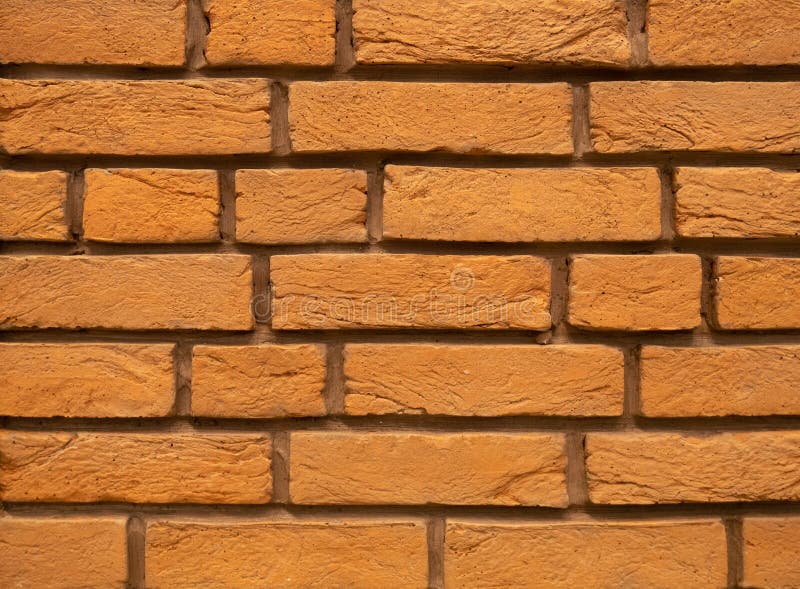 Orange abstrakt bakgrund för tegelstenvägg som designbeståndsdel fotografering för bildbyråer Orange abstrakt bakgrund för tegelstenvägg som designbeståndsdel fotografering för bildbyråer