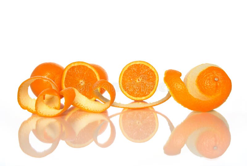 Tasty oranges and spiral orange peel reflecting on white background. Tasty oranges and spiral orange peel reflecting on white background.