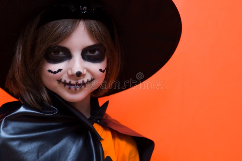 Halloween. Portrait of a Girl Made Up on an Orange Background Stock ...