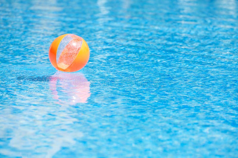 An Orange Ball in the Blue Water Swimming Pool Stock Image Image of