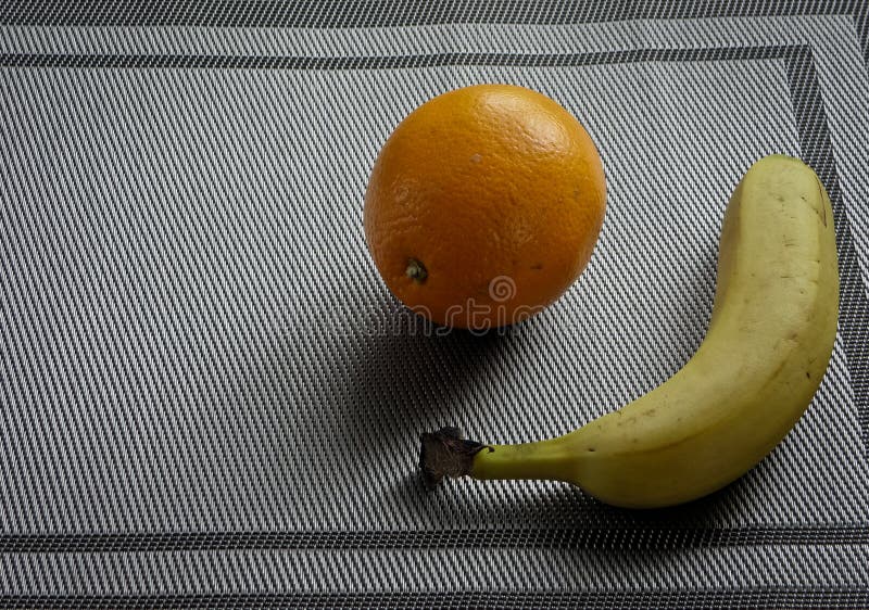 Orange banana, tropical fruits on the table stock photo Orange banana, tropical fruits on the table stock photo