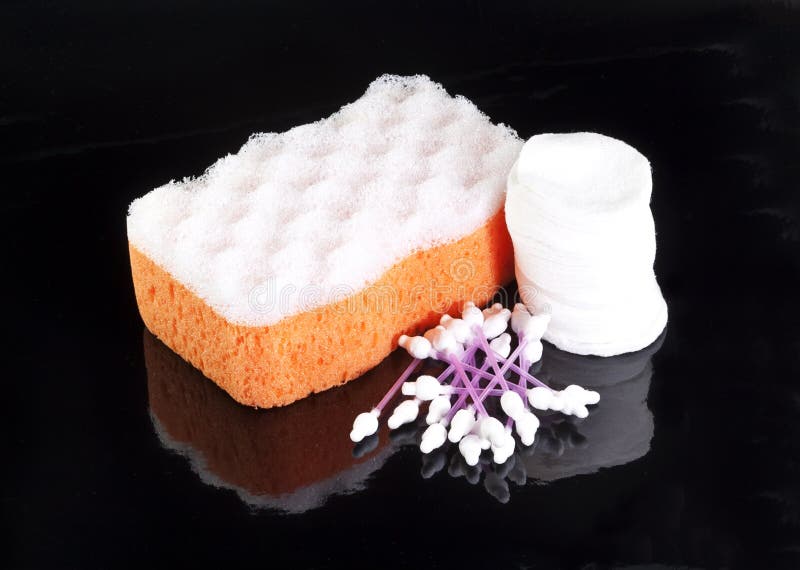 Orange Bathing Sponge with White Cotton Discs and Cotton Sticks Stock