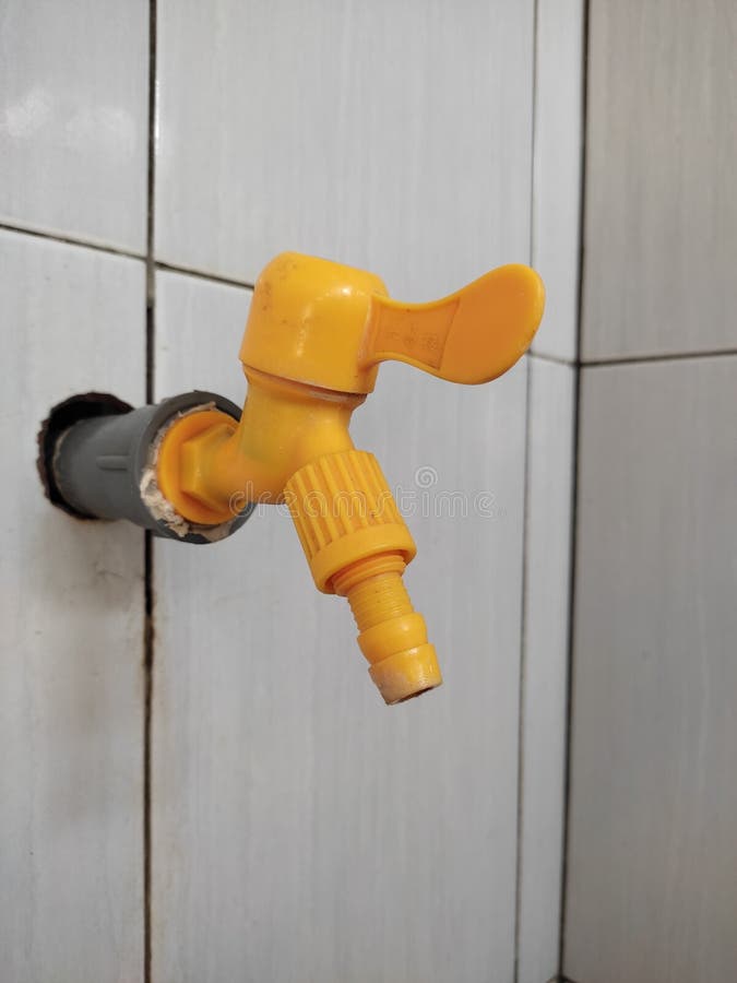 Orange Bathroom Faucet, Made of Plastic. Stock Photo Image of