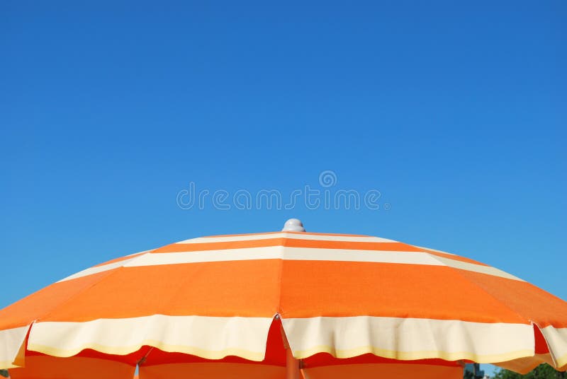 Orange beach umbrella stock image. Image of beach, summer 15874613