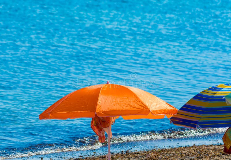 Orange Beach Umbrella by the Sea in Summer Day Stock Photo Image of tropic, blue 153653200
