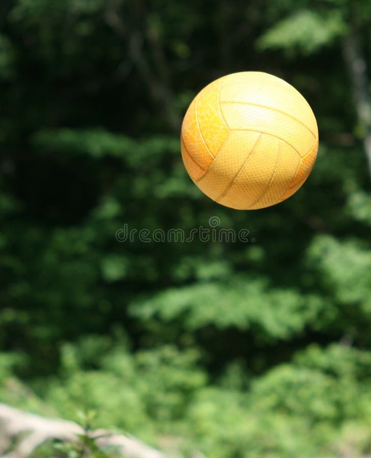 Orange beach voleyball ball in air