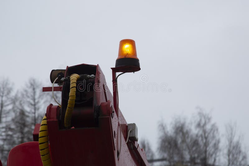 An orange beacon on a special service vehicle. Road equipment stock image