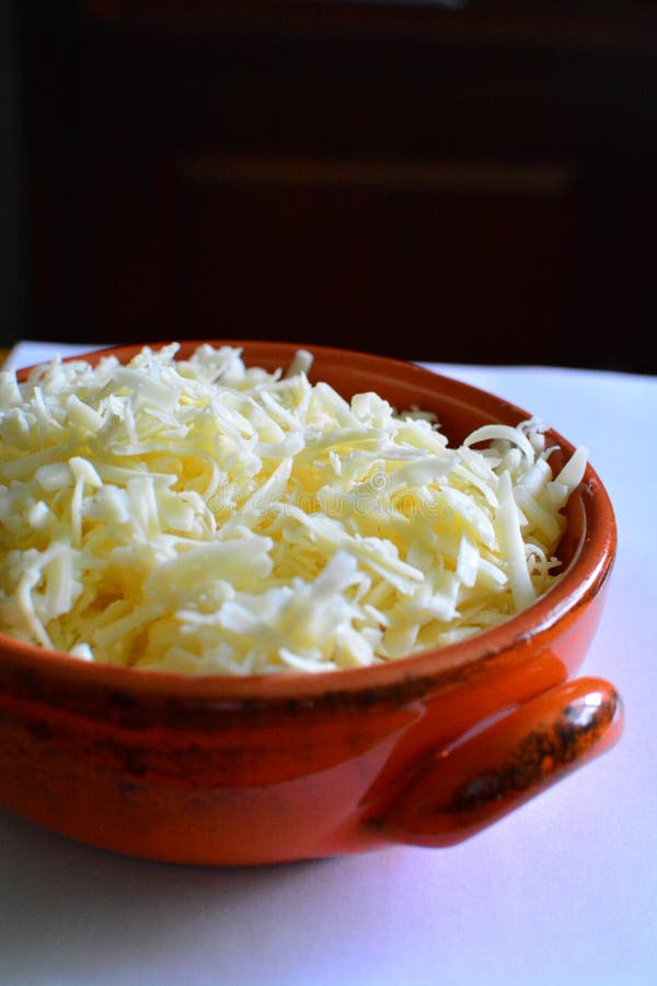 Orange Bowl of Shredded Cheese Stock Photo Image of taste, recipe 250580484