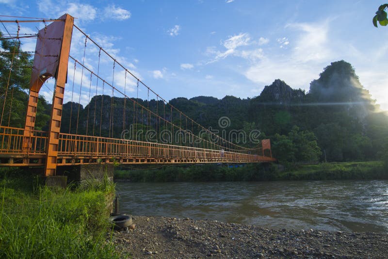 ORANGE BRIDGE, VANG VIENG, LAOS - JULY 25, 2019: stock photography ORANGE BRIDGE, VANG VIENG, LAOS - JULY 25, 2019: stock photography
