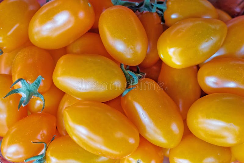 Orange cherry tomatoes top view closeup