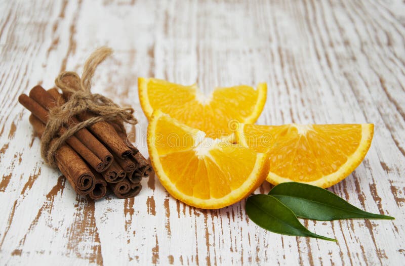 Orange with Cinnamon Sticks Stock Photo Image of portion, background