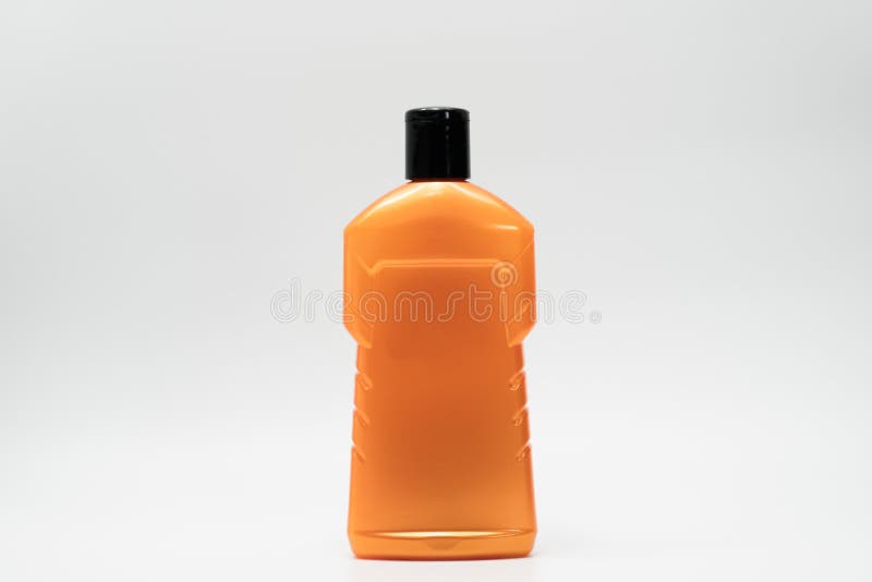 Orange cosmetic bottle isolated royalty free stock photography