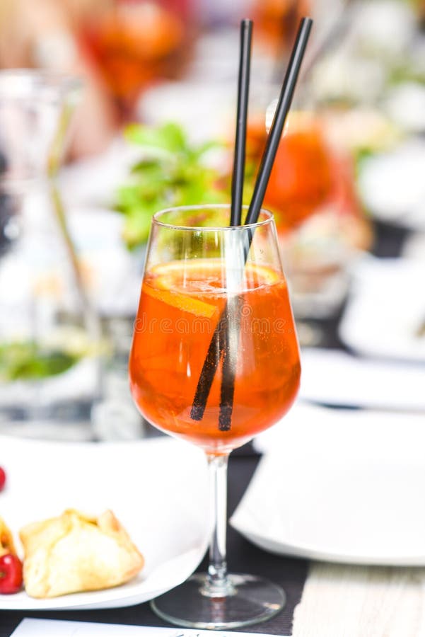 A Orange Drink in a Glass of Wine in the Restaurant Beautifully Stock