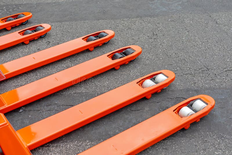 Orange Forks Pallet Jack stock photo. Image of pallet 221210526